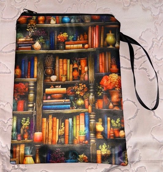 Books on a shelf Book Pouch